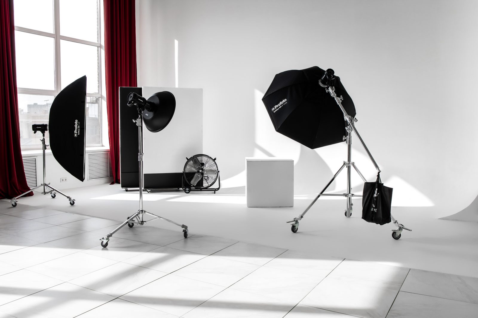 Family portrait photography session in a professional studio with soft lighting and joyful atmosphere